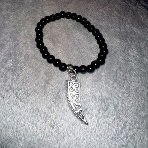 Black bracelet with pendant